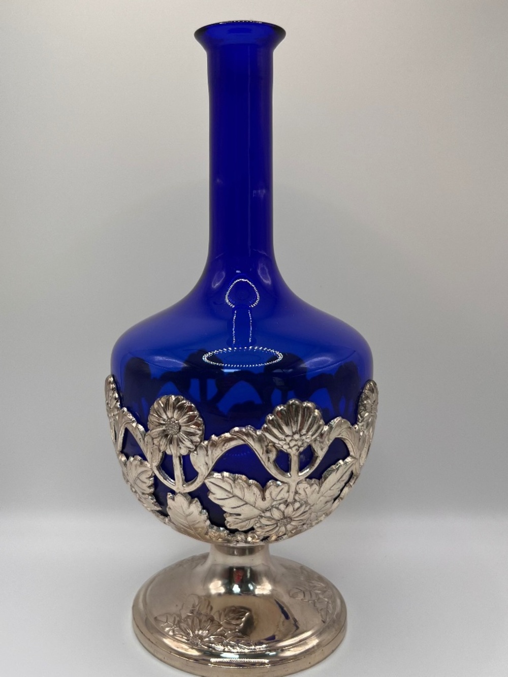 Cobalt decanter Sliver Plated overlay ornate base. Floral pattern. Vintage